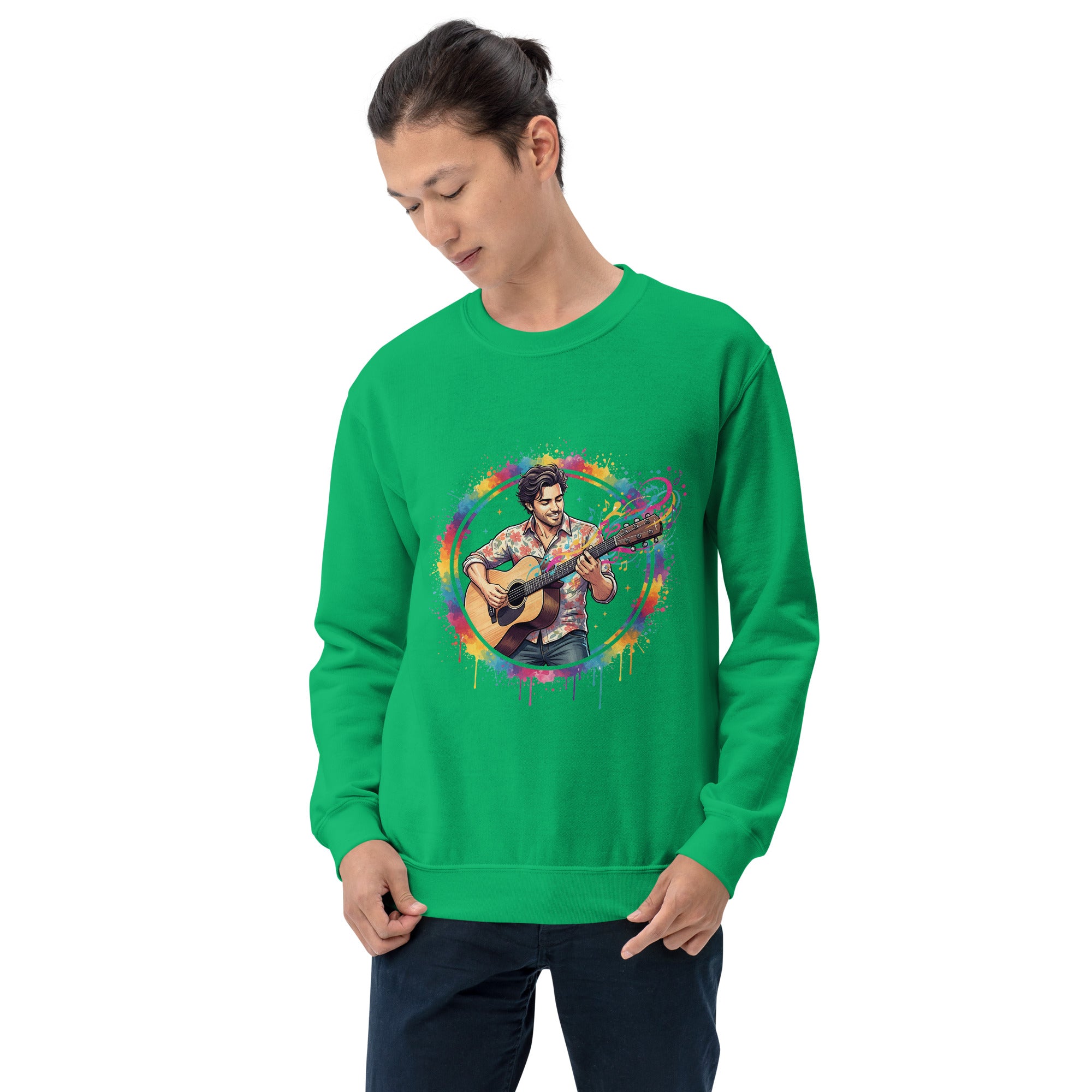 Person wearing a green sweatshirt with a colorful graphic of a person playing guitar on a white background