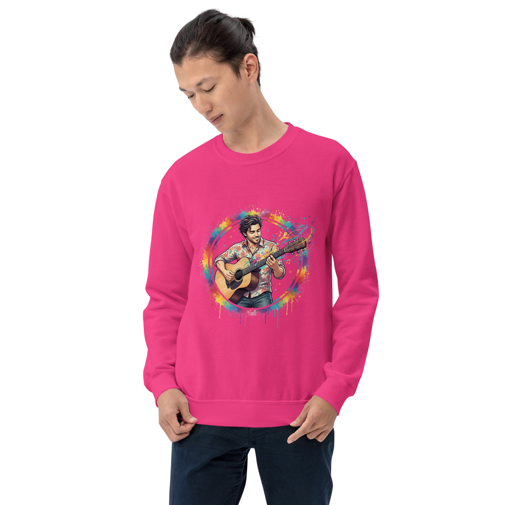 Person wearing a pink sweatshirt with a colorful graphic of a person playing guitar on a white background