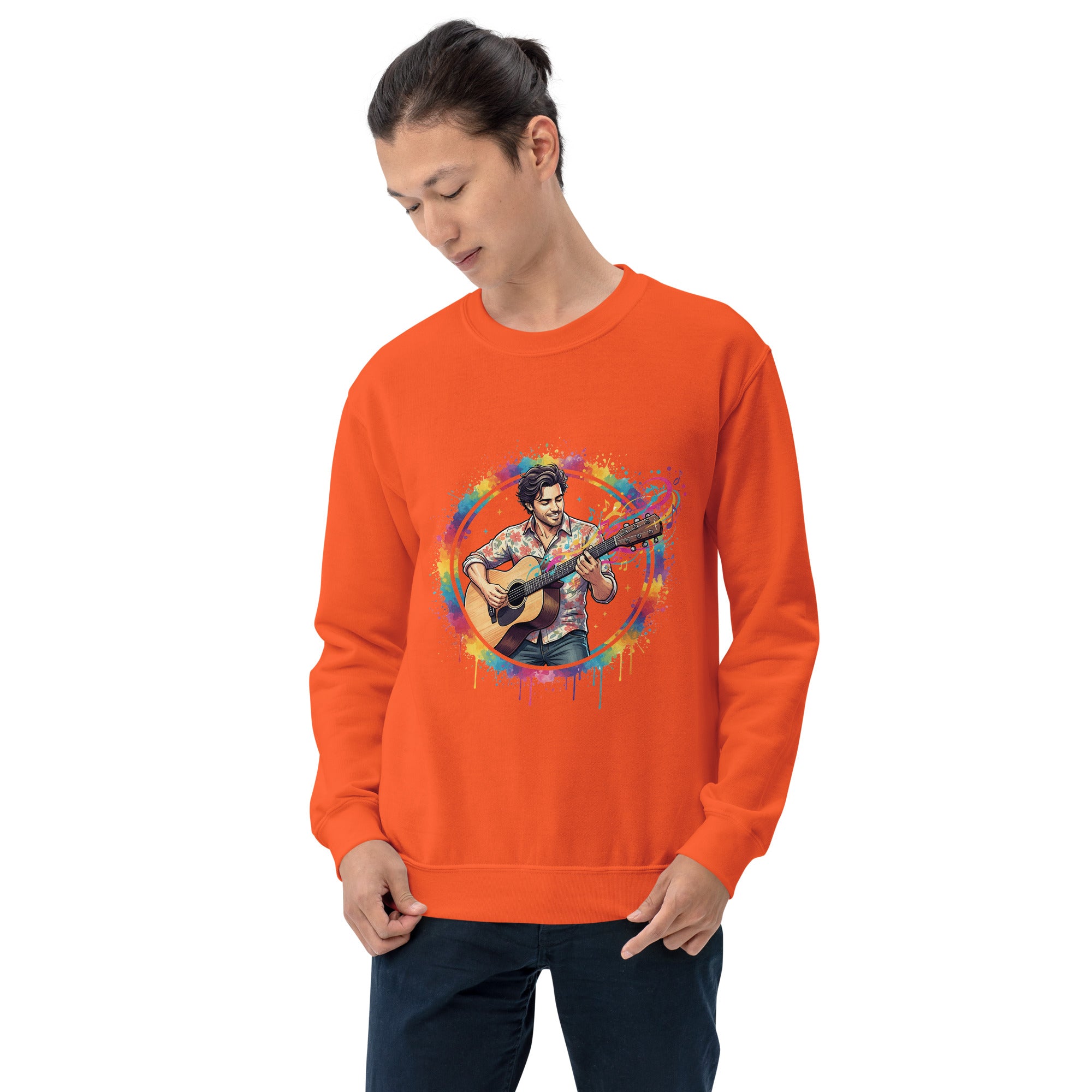 Person wearing an orange sweatshirt with a colorful graphic design on a white background