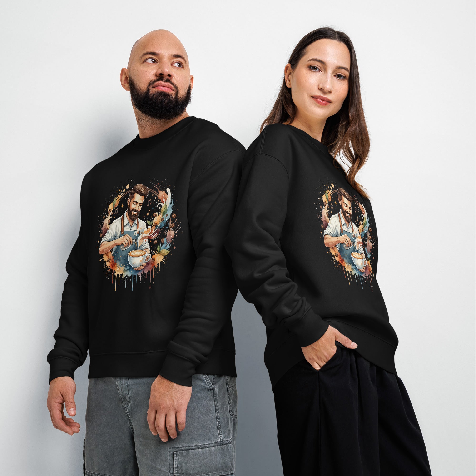 Two people wearing black sweatshirts with a colorful graphic design on a plain background