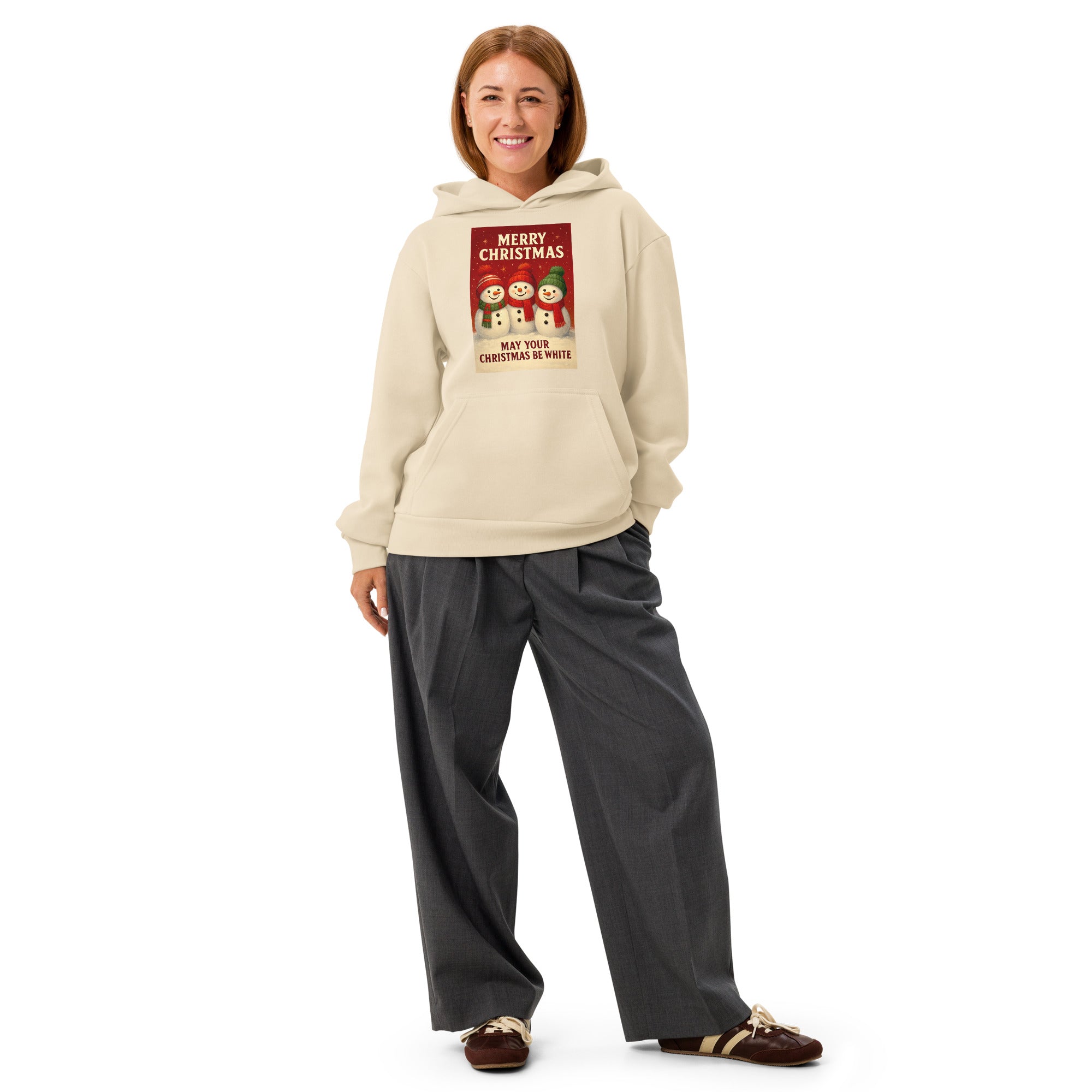 Heavyweight Christmas hoodie featuring three snowmen and the text "Merry Christmas May Your Christmas Be White" on a cream-colored sweatshirt. Festive print on an oversized fit winter apparel.